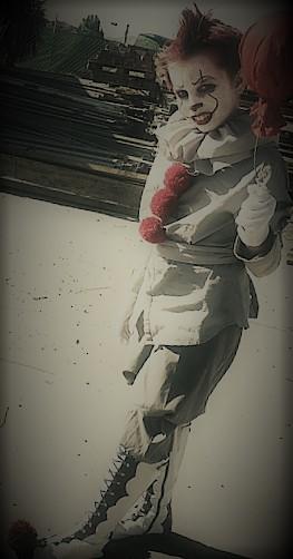 creepy child in Pennywise costume